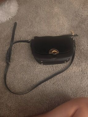 Classic Black Crossbody Saddle Bag with Gold Accent